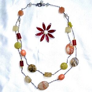 stone necklace and flower pin